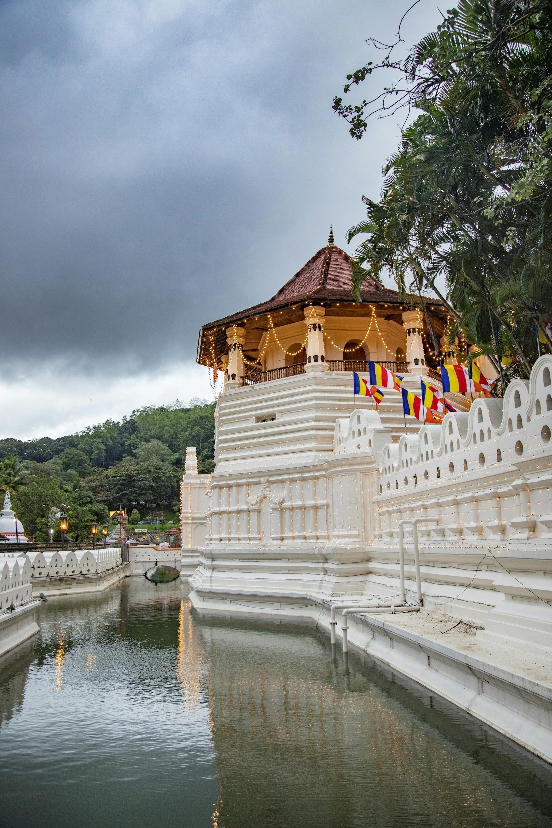 The Temple of the Sacred Tooth Relic in Kandy, with white walls and tiled roofs